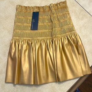 Girls size 14 gold skirt leather/pleather textured,shiny, new with tags.